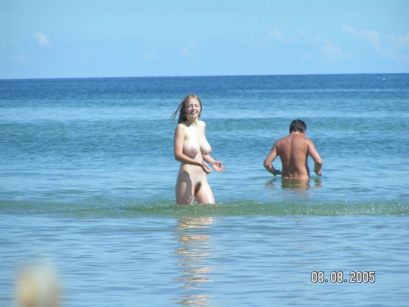 Candid Beach Nudism - Busty teen nudist candid pictures at the beach taking a dip