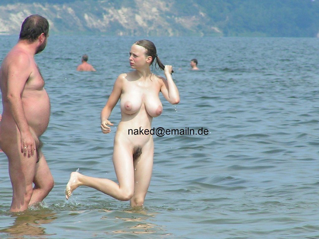 Busty teen nudist candid pictures at the beach taking a