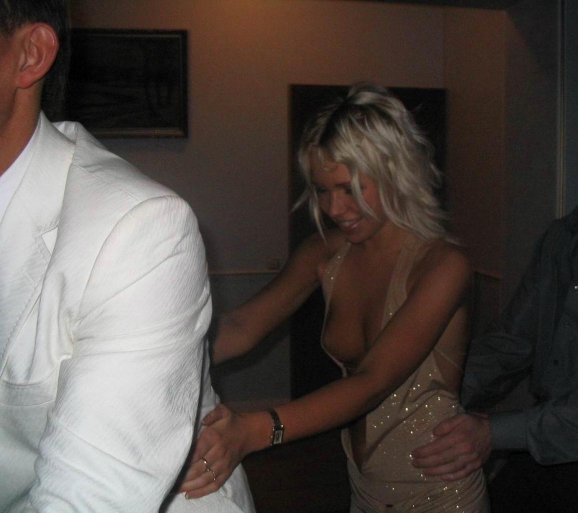 Candid nip slip from a girl wearing a sexy dress at a party